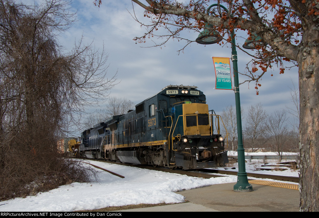 MEC 5973 Leads the Wreck Train by Saco Station